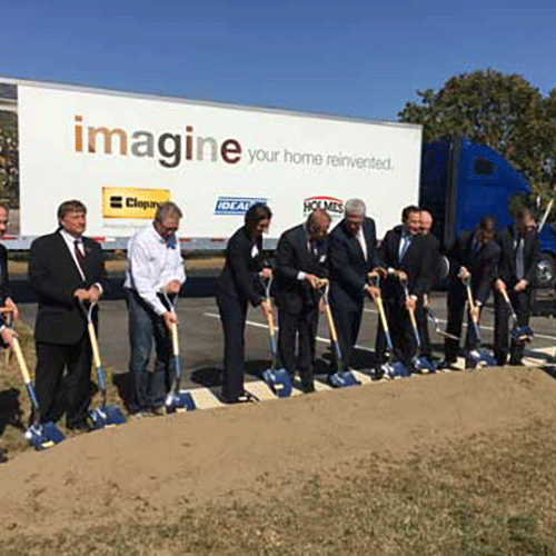 Group breaking construction ground with shovels